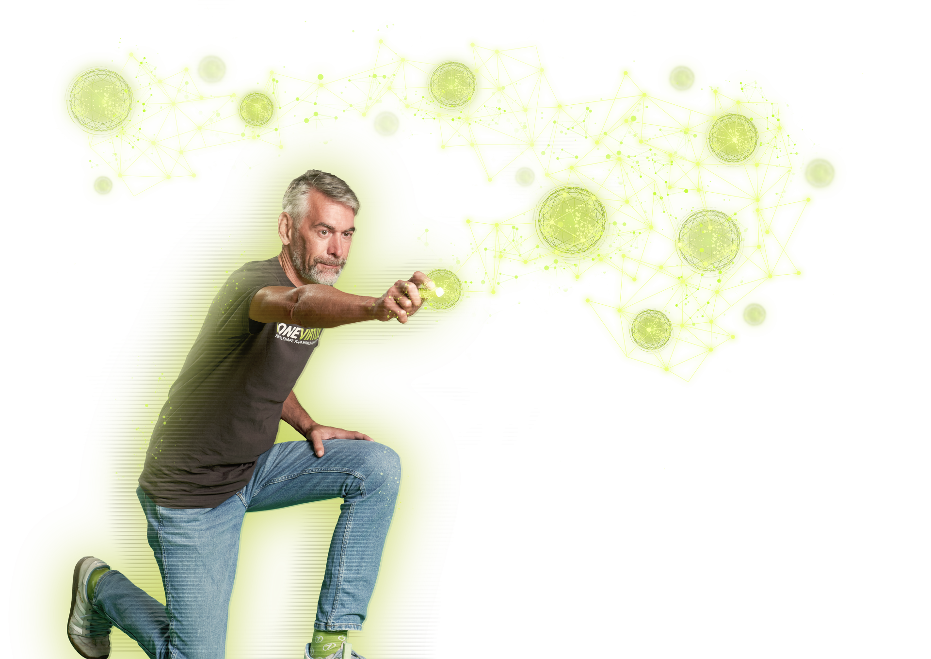 virtual7 employee in jeans and T-shirt kneels and interacts with glowing green digital networks.