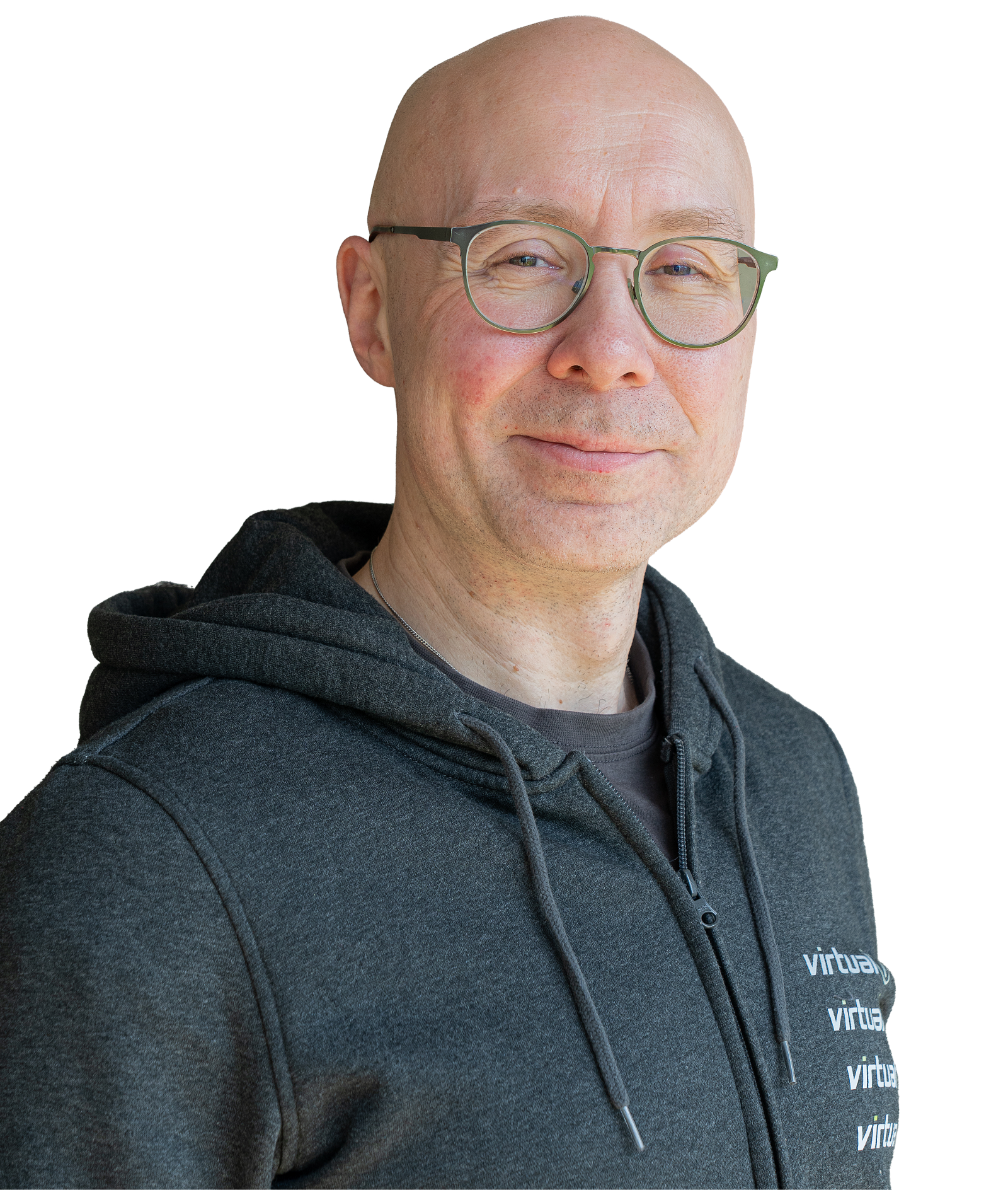 Portrait of Philipp wearing a dark gray virtual7 hoodie against a light background, wearing glasses and looking friendly.